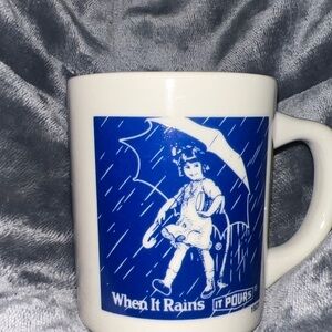 White Mug with Blue Design - When It Rains It Pours 1921
